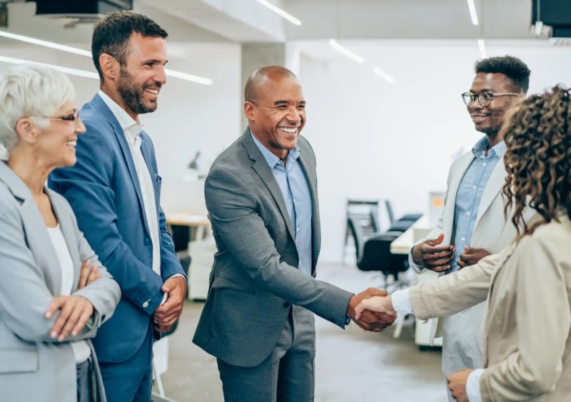 Business meeting with people shaking hands.