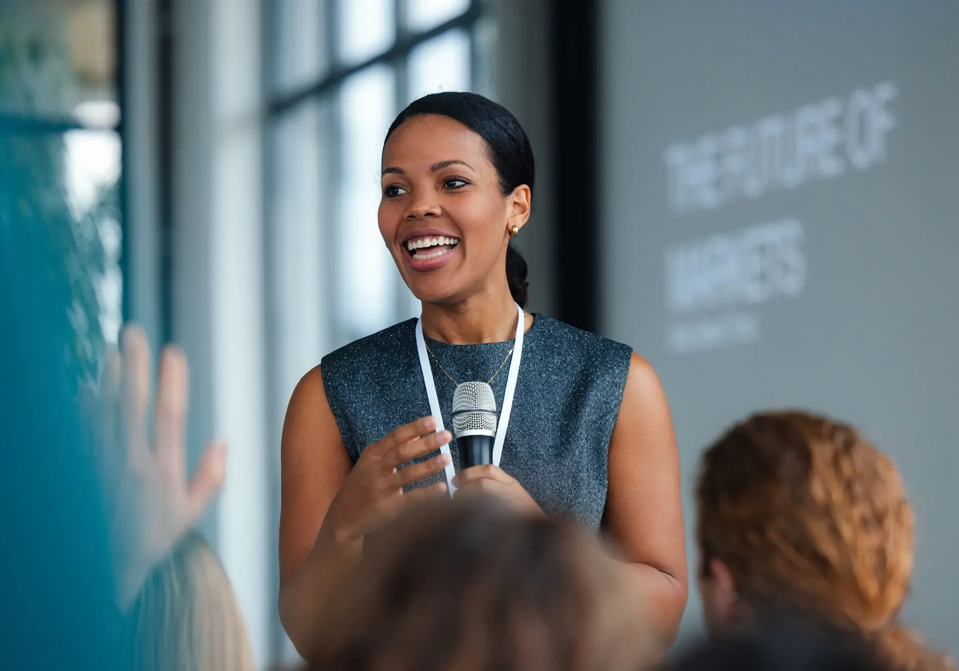 Speaker presenting at a conference event.