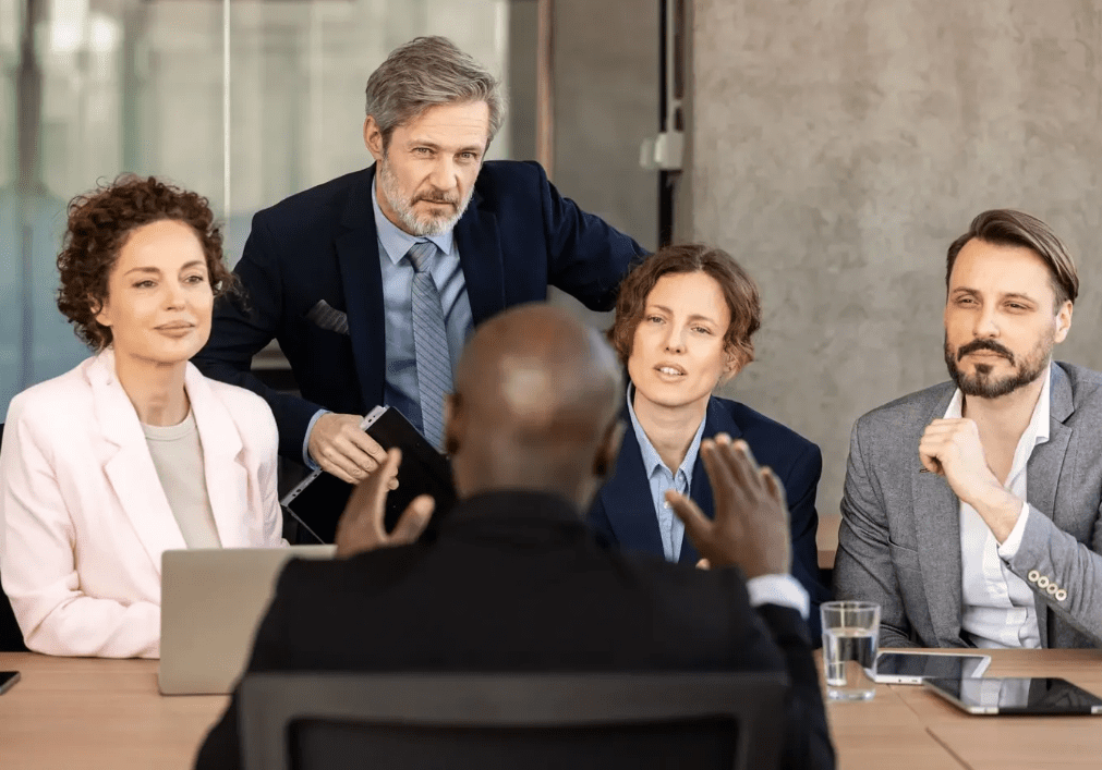 Business meeting with attentive group of professionals.