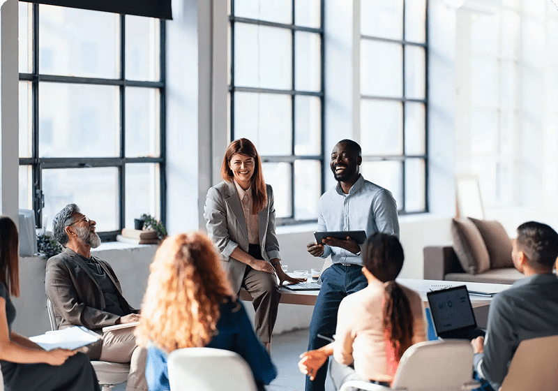 Colleagues collaborating in open-plan office